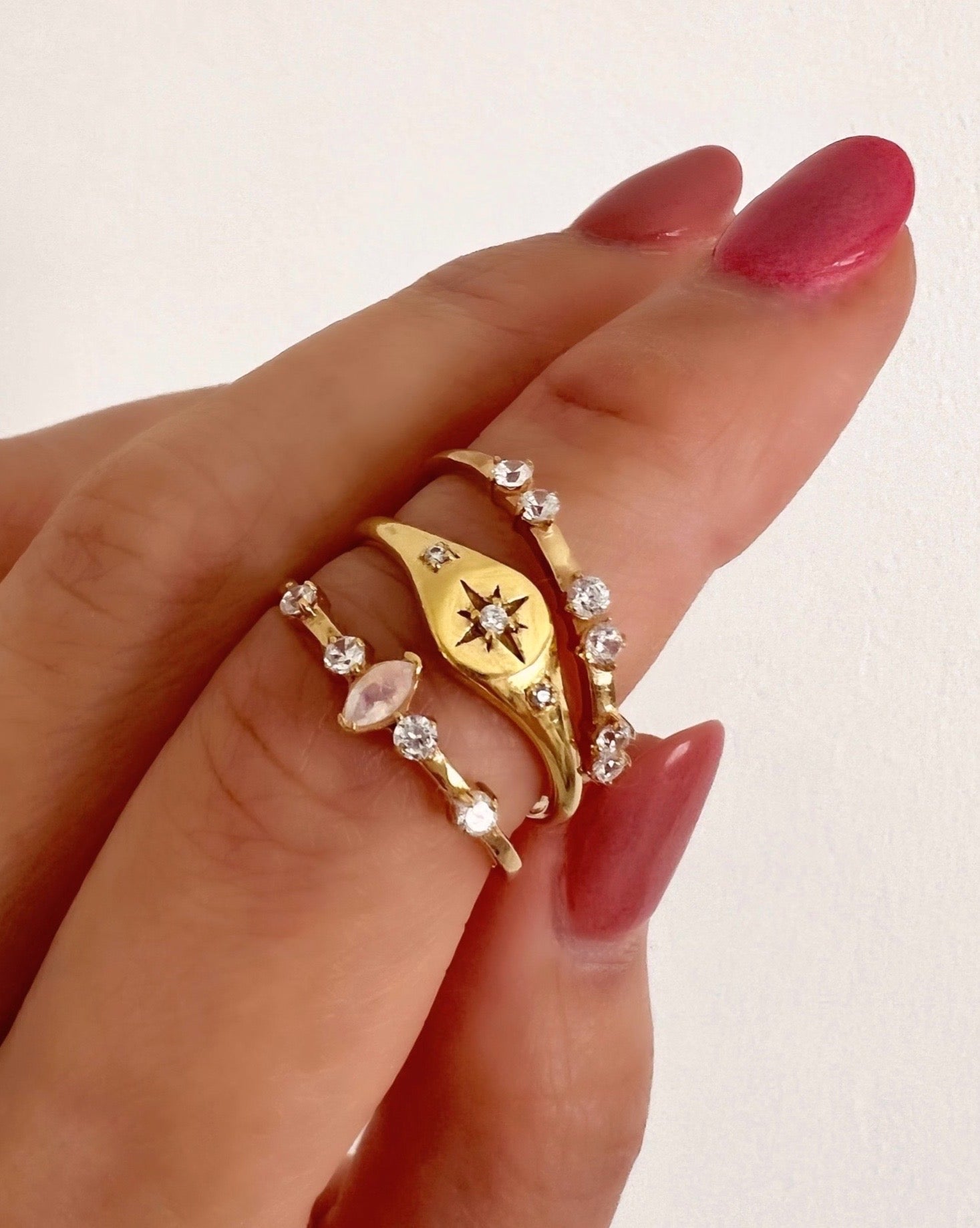 14k gold fill moonstone marquise ring with marquise shaped moonstone and 4 micro pave cubic zirconia crystals on a model
