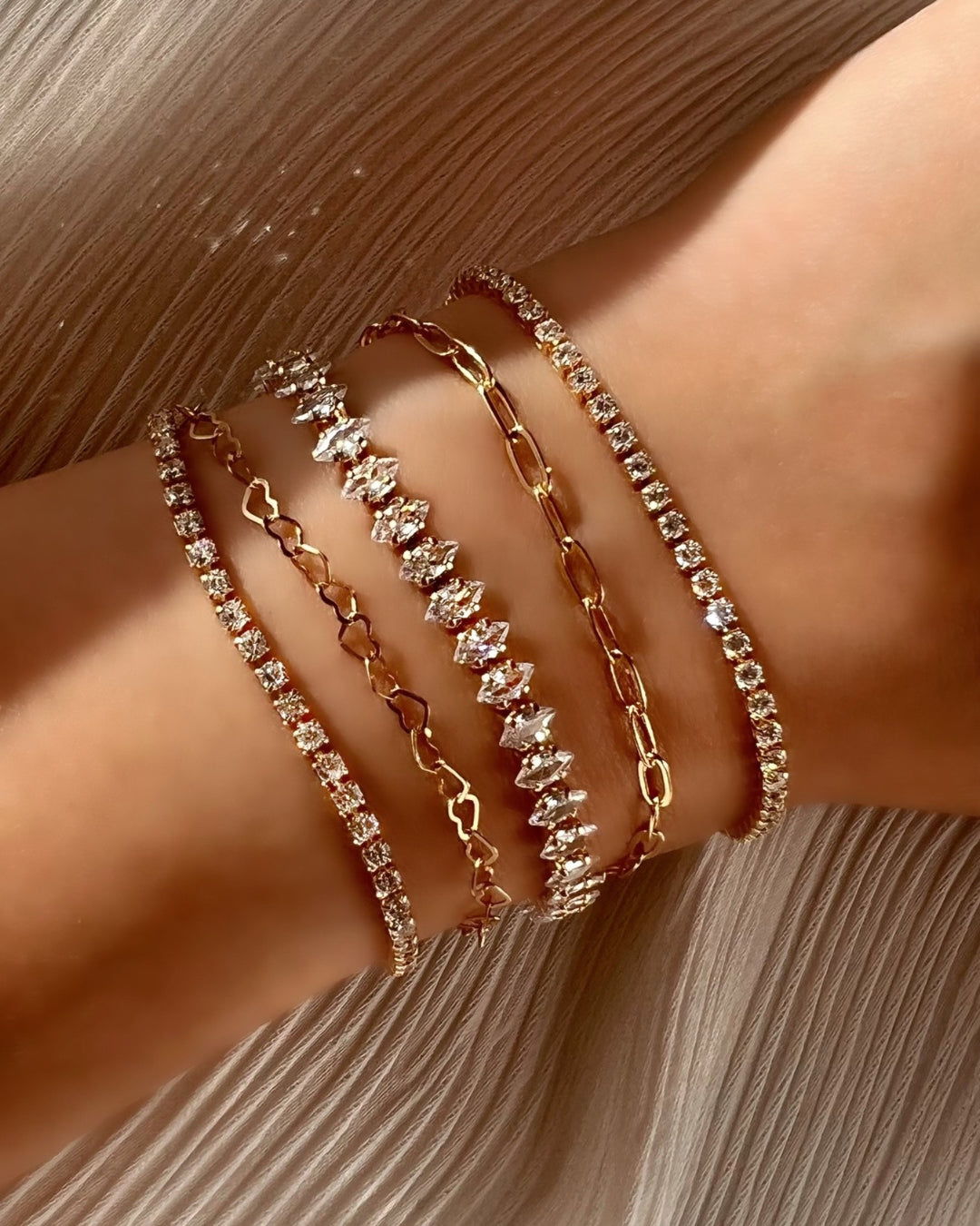 14k yellow gold fill petite tennis diamond bracelet on a model