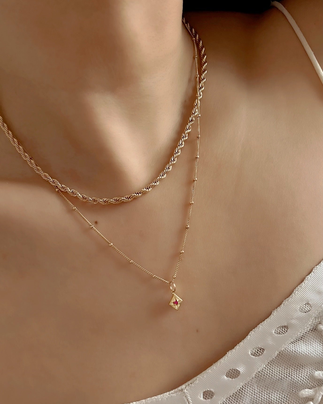 14k gold fill Asteria star mini pendant charm with pink ruby cubic zirconia diamond crystal. Made in Australia.