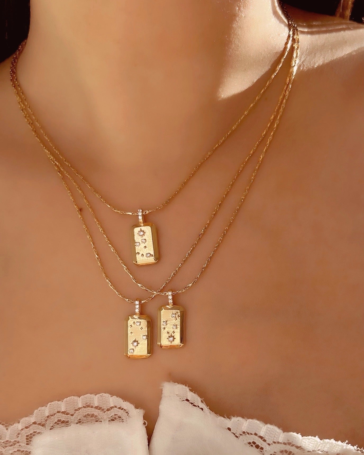 Gold Aquarius Constellation Zodiac Pendant on a Gold Necklace Chain on a model