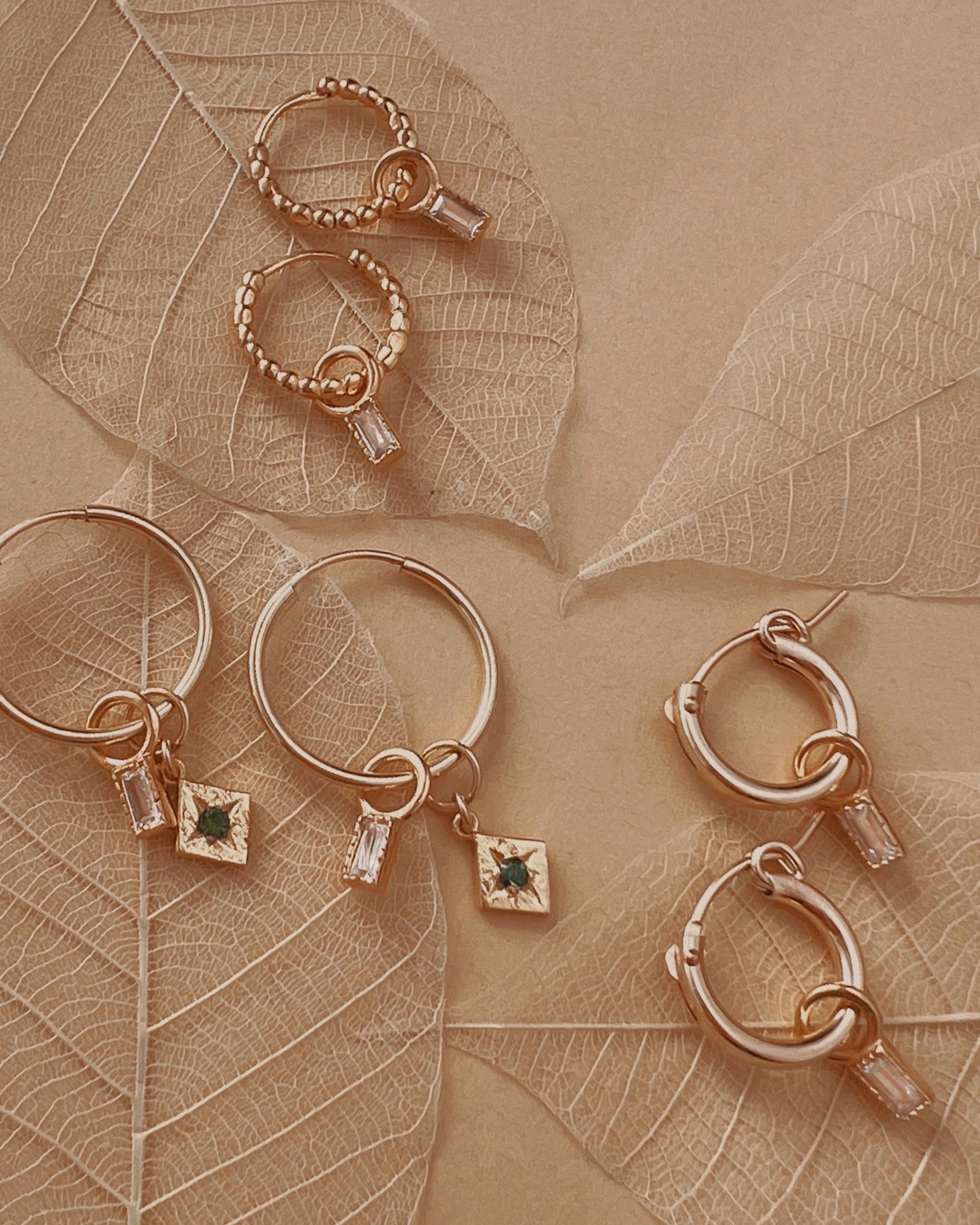 14k yellow gold fill Huggie hoops earrings. Made in Australia. Classic minimal plain gold small infinity hoops