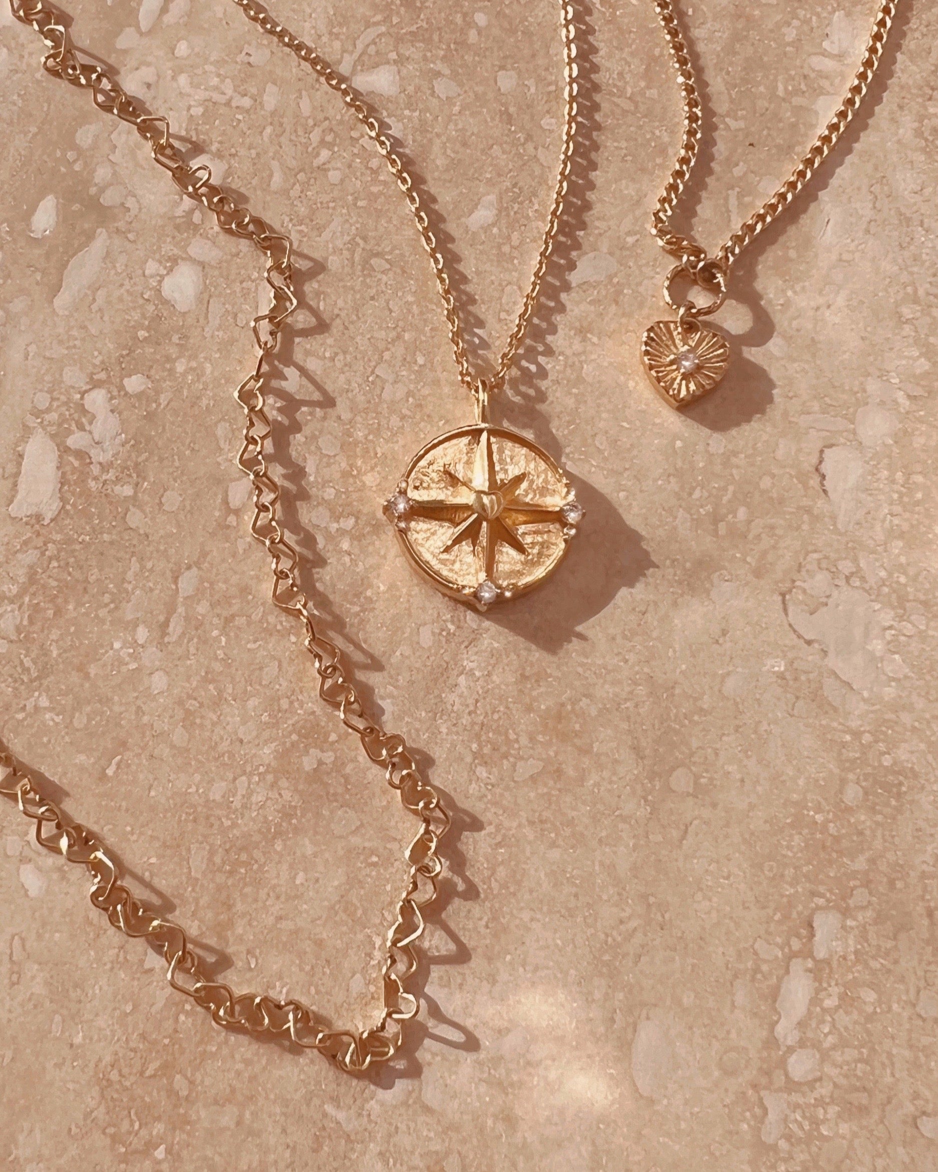 14k gold fill dreamers pendant on a necklace chain featuring a love heart centre on a North Star