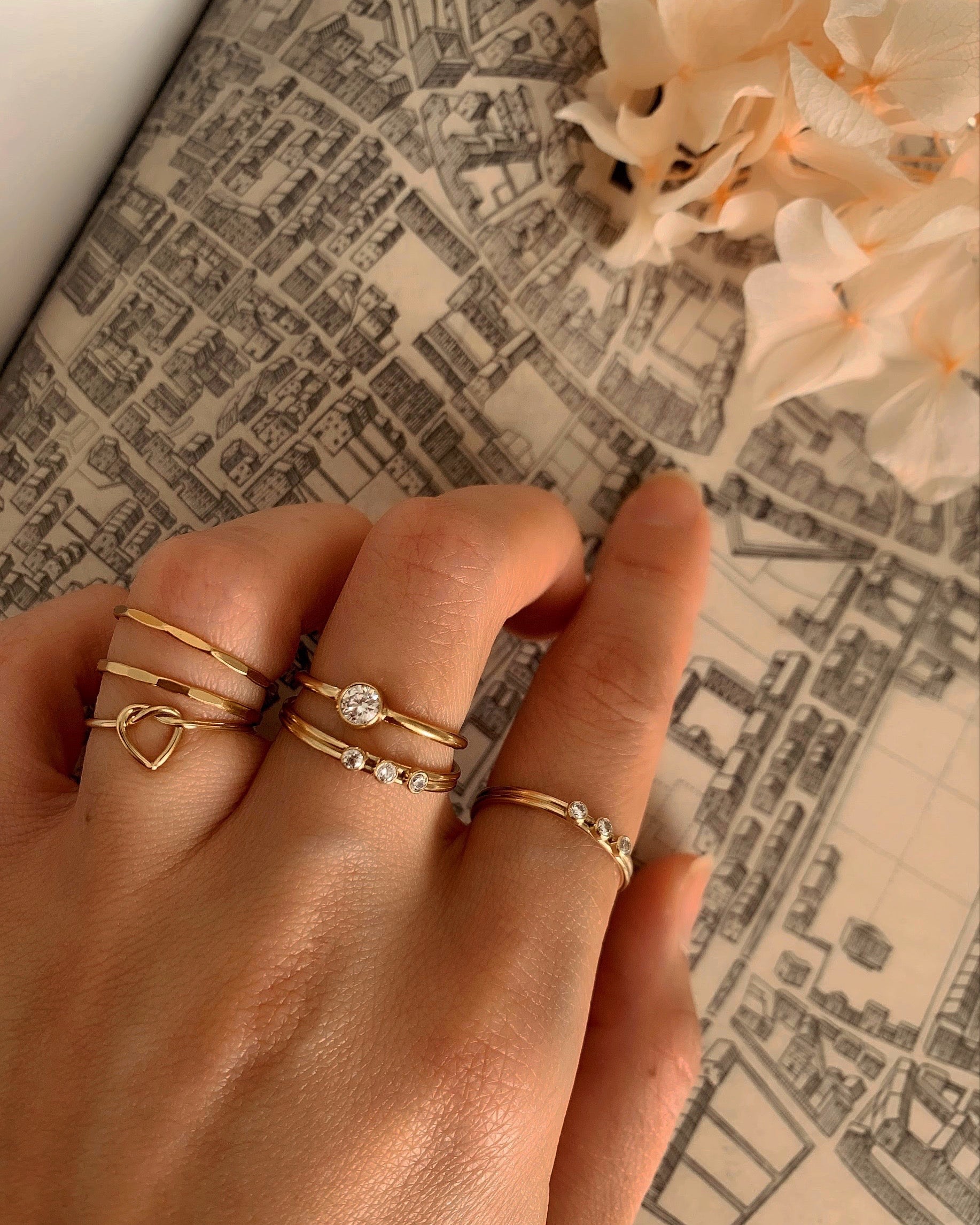 14k gold fill love heart knot stacking ring on a model