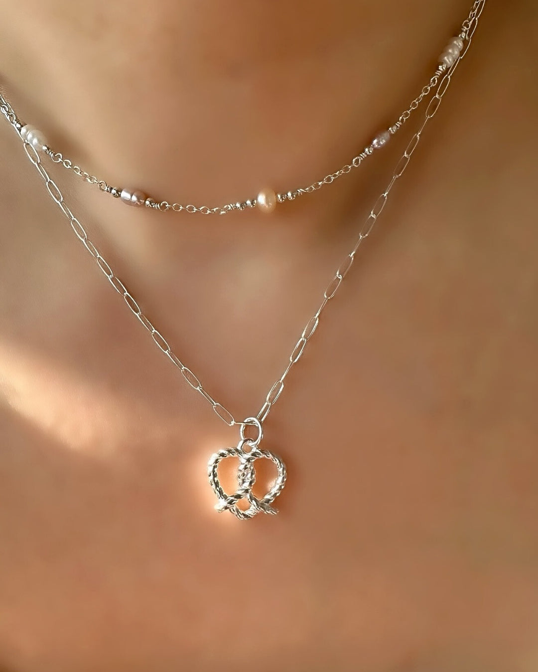 Sterling Silver pretzel love heart pendant to be paired with necklace chains. Customise with silver necklace chains. Ethically designed in Australia. 