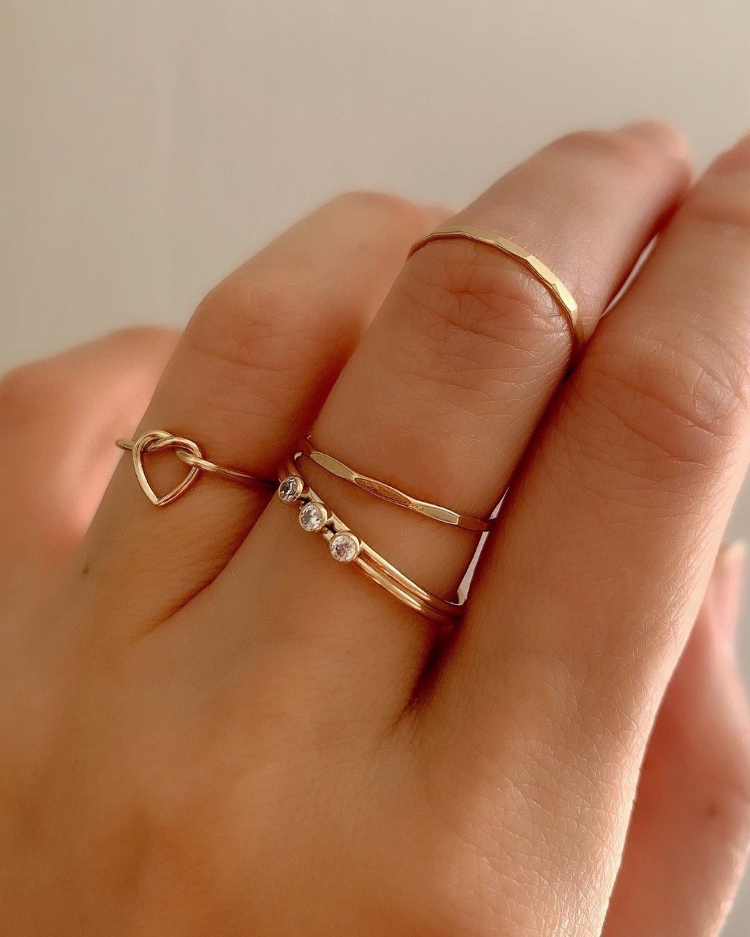 14k gold fill faceted stacking ring on a model. 