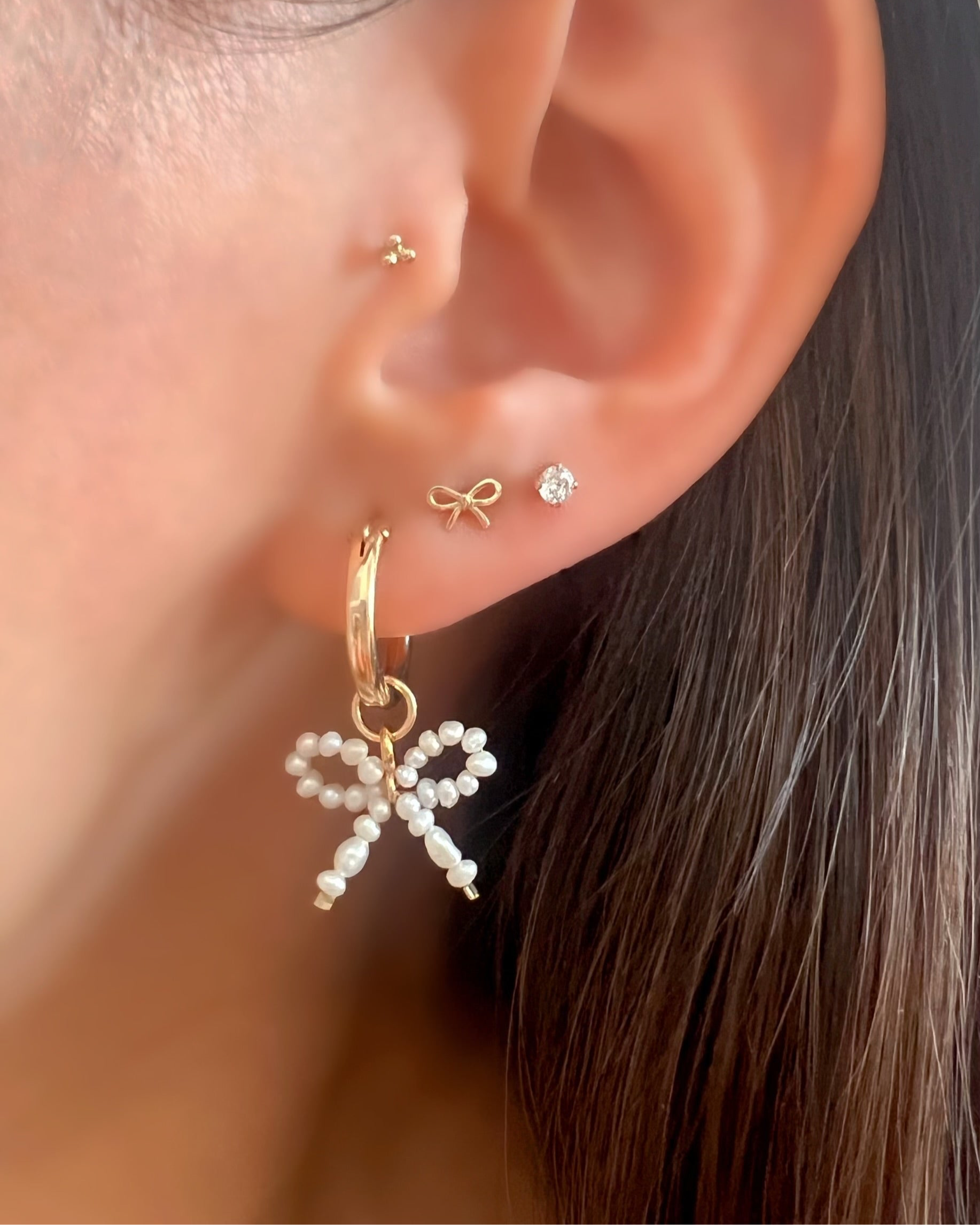 14k solid gold yellow bow stud earrings with butterfly backing. Dainty, ribbon earrings, coquette jewellery, soft girl aesthetic, made in Australia.