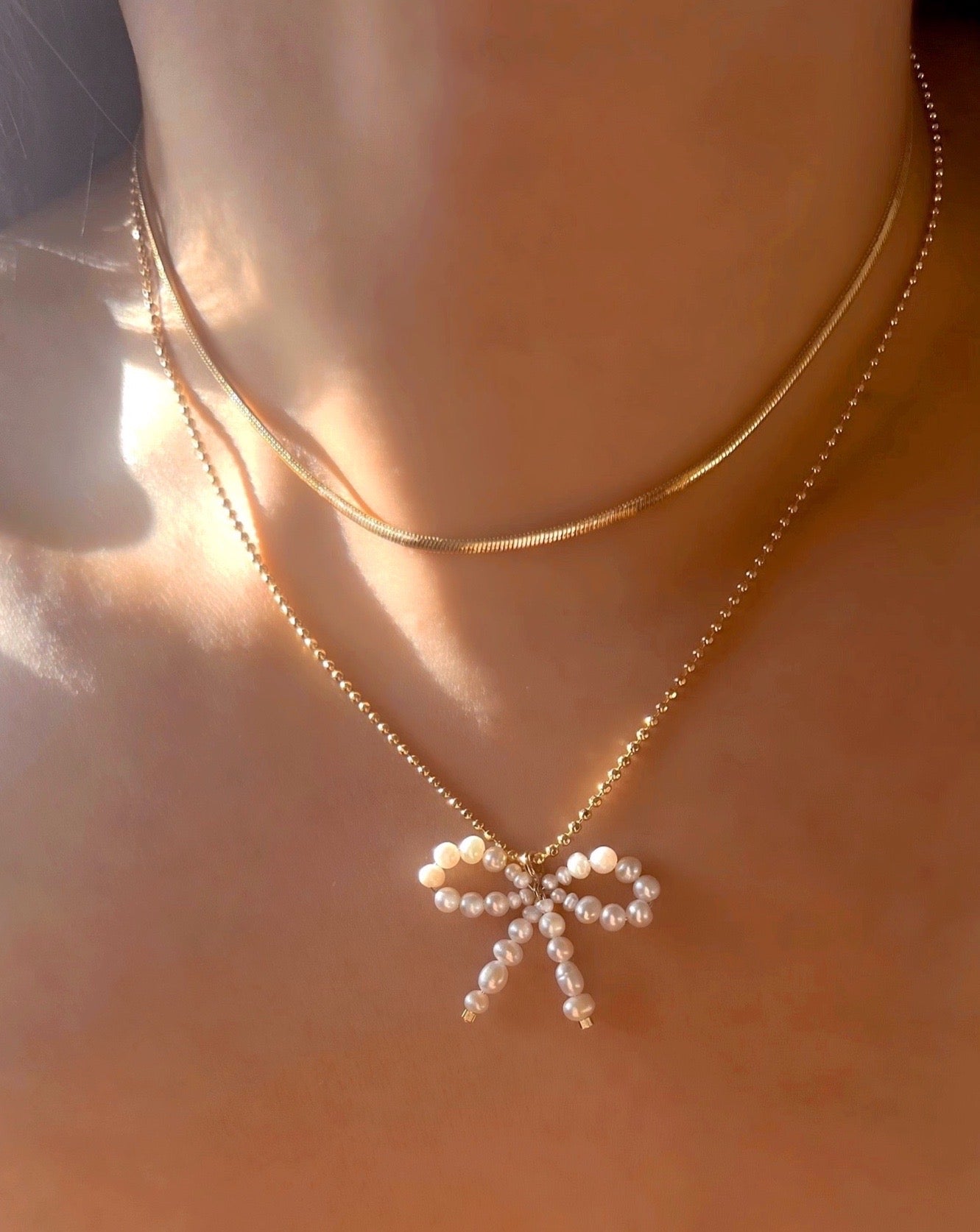 Gold Pearl Bow Necklace