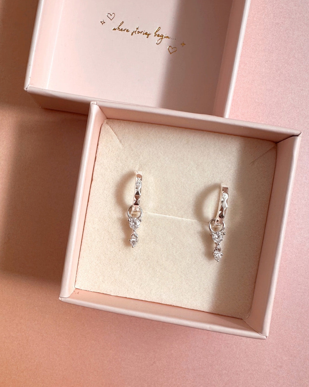 Sterling silver textured wave hoop earrings with removable triple crystal drop charms in a Romyli gift box 