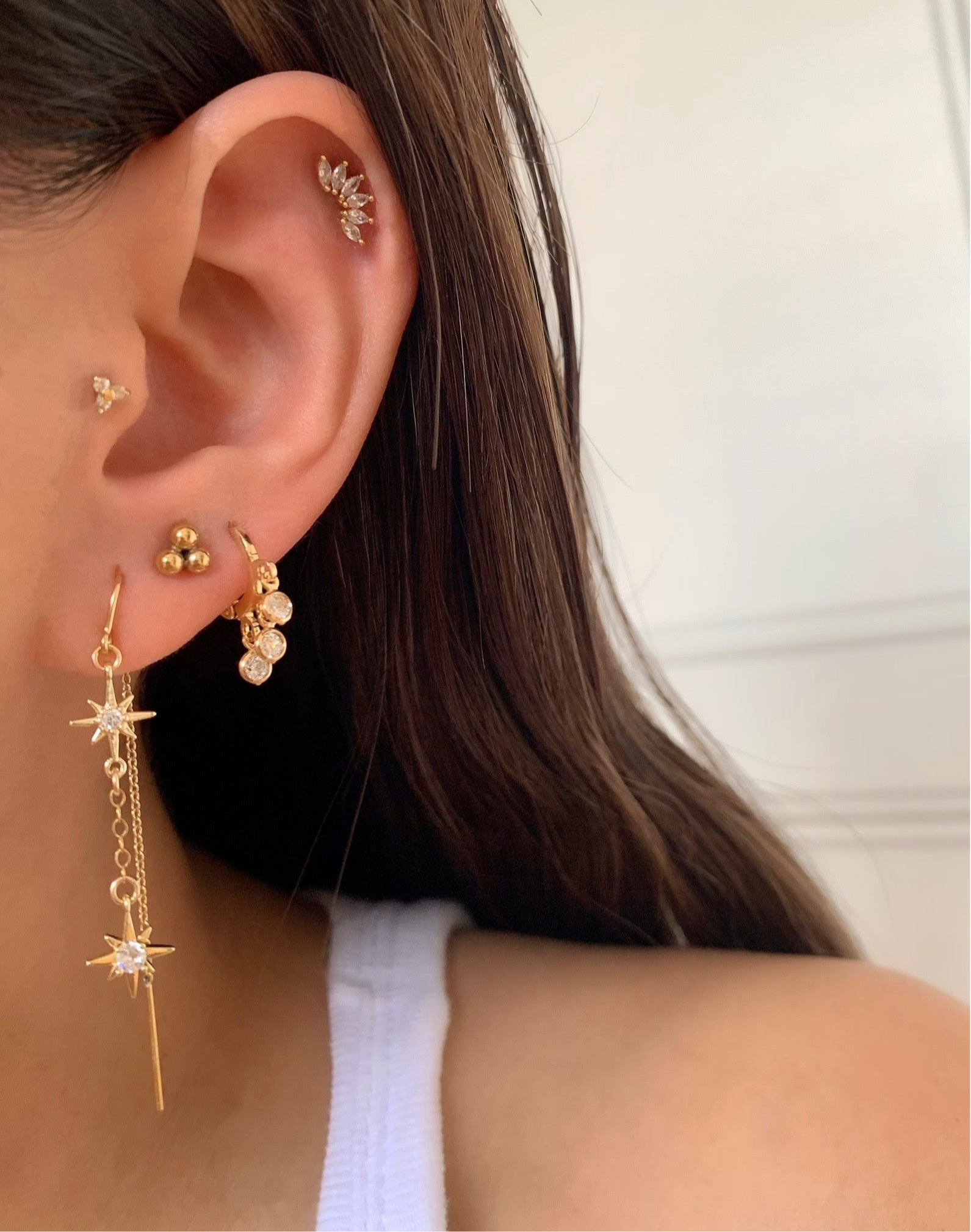 14k gold fill trinity sphere stud earrings on a model