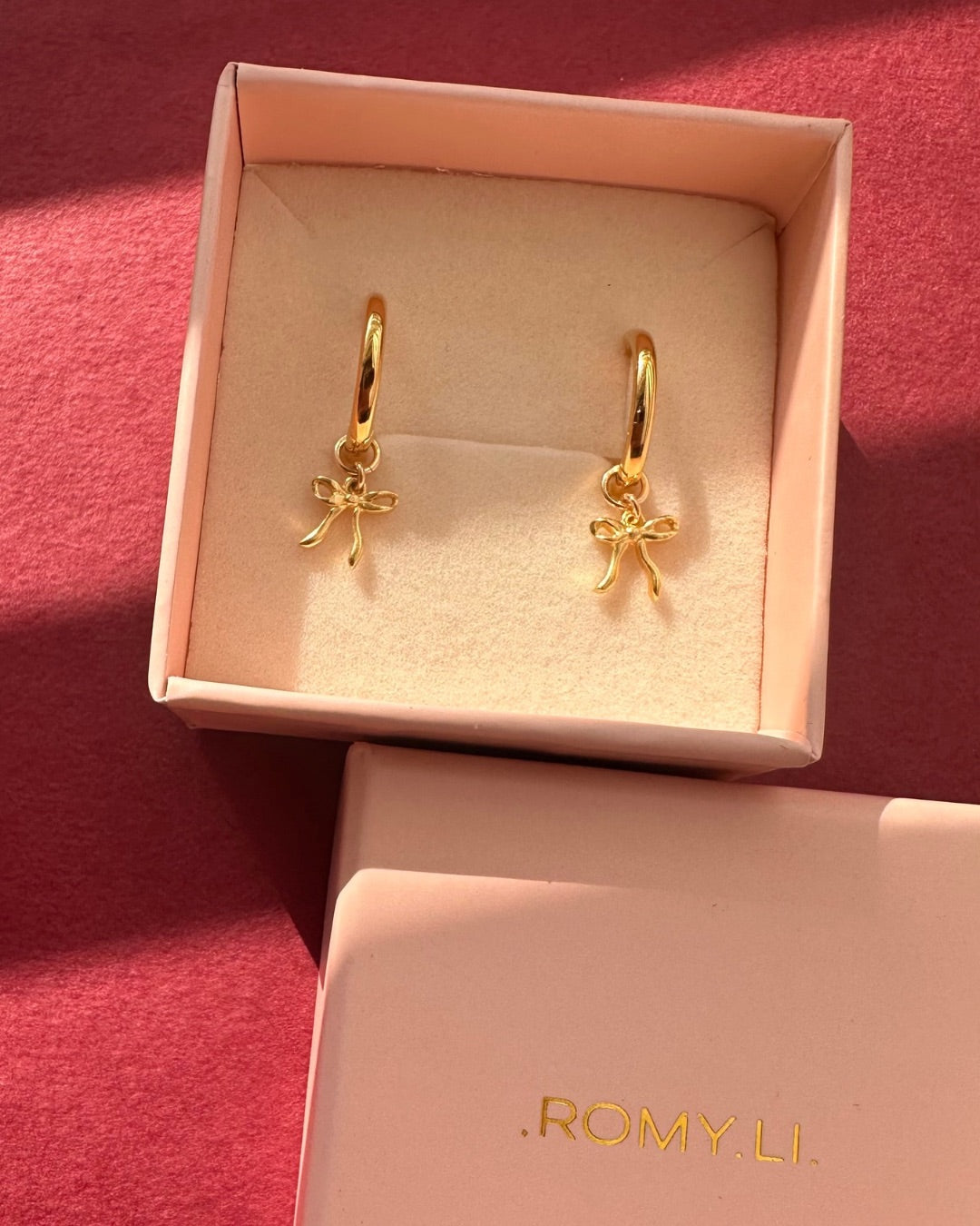 Medium Bow Charm Hoops in a pink Romyli gift box