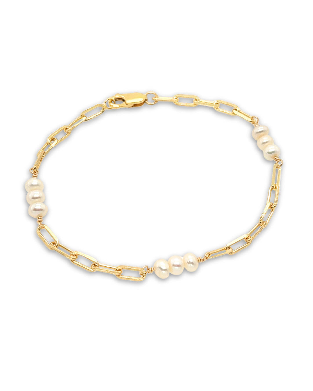 Handcrafted pearl link bracelet with trio of freshwater pearls interspaced on a dainty paperclip chain, designed in Melbourne, Australia. Elegant, timeless pearl bracelet for layering or solo wear.