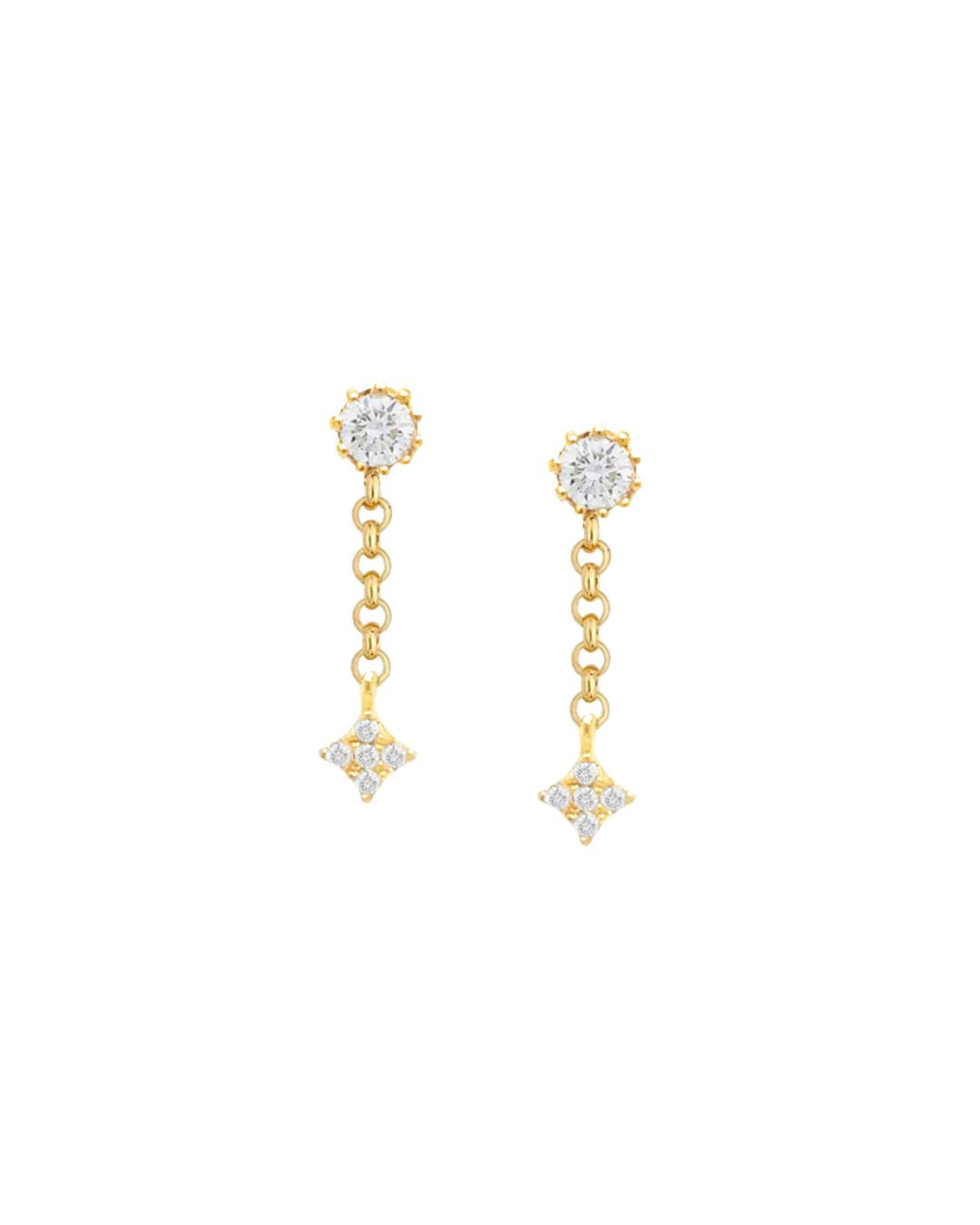 A pair of gold-colored stud earrings with milgrain crystal embellishments and small north star charms at the bottom.