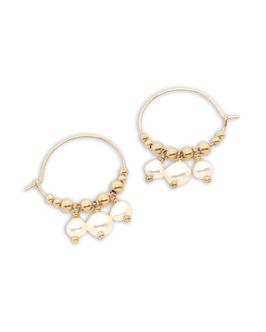 Cascade pearl hoops with a flowing arrangement of baroque and seed pearls on gold fill hoops, designed and made in Australia. Elegant pearl hoop earrings for a timeless, sophisticated style.