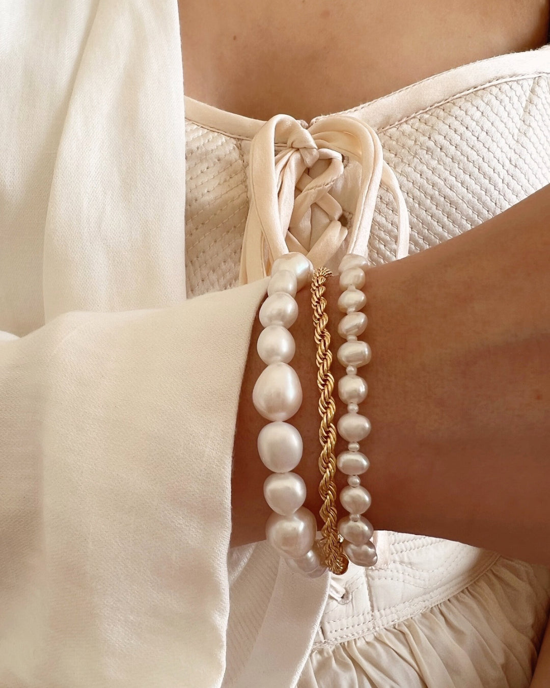 Australian-designed Baroque Pearl Bracelet featuring natural, irregular baroque pearls for a timeless, elegant look. Styled layered with our Pearl Orb and Chunky Rope Bracelet. 