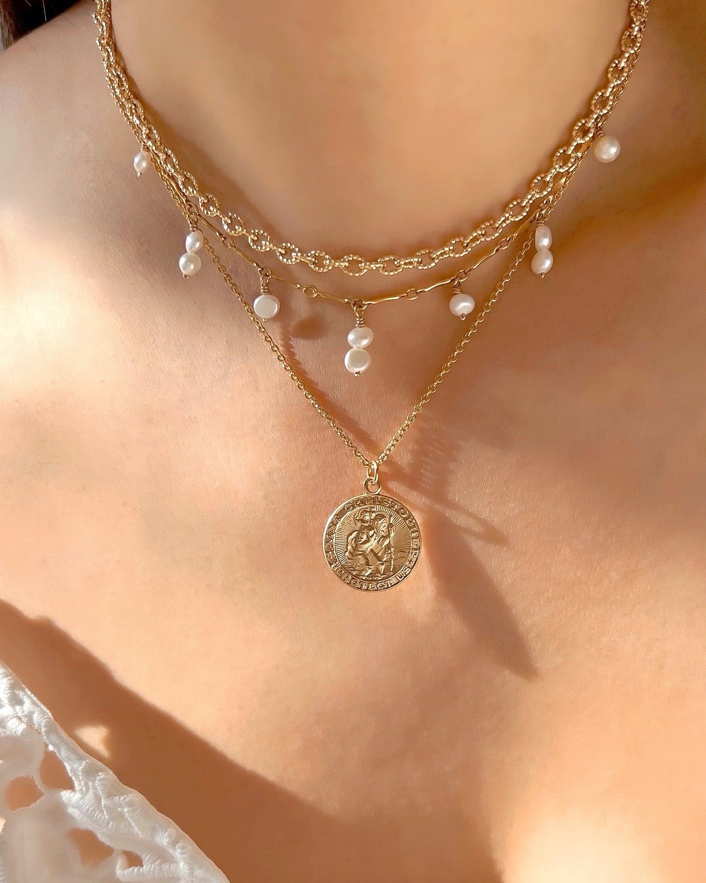 Gold St Christopher Medallion Pendant on a Gold Fill Necklace Chain on a model 