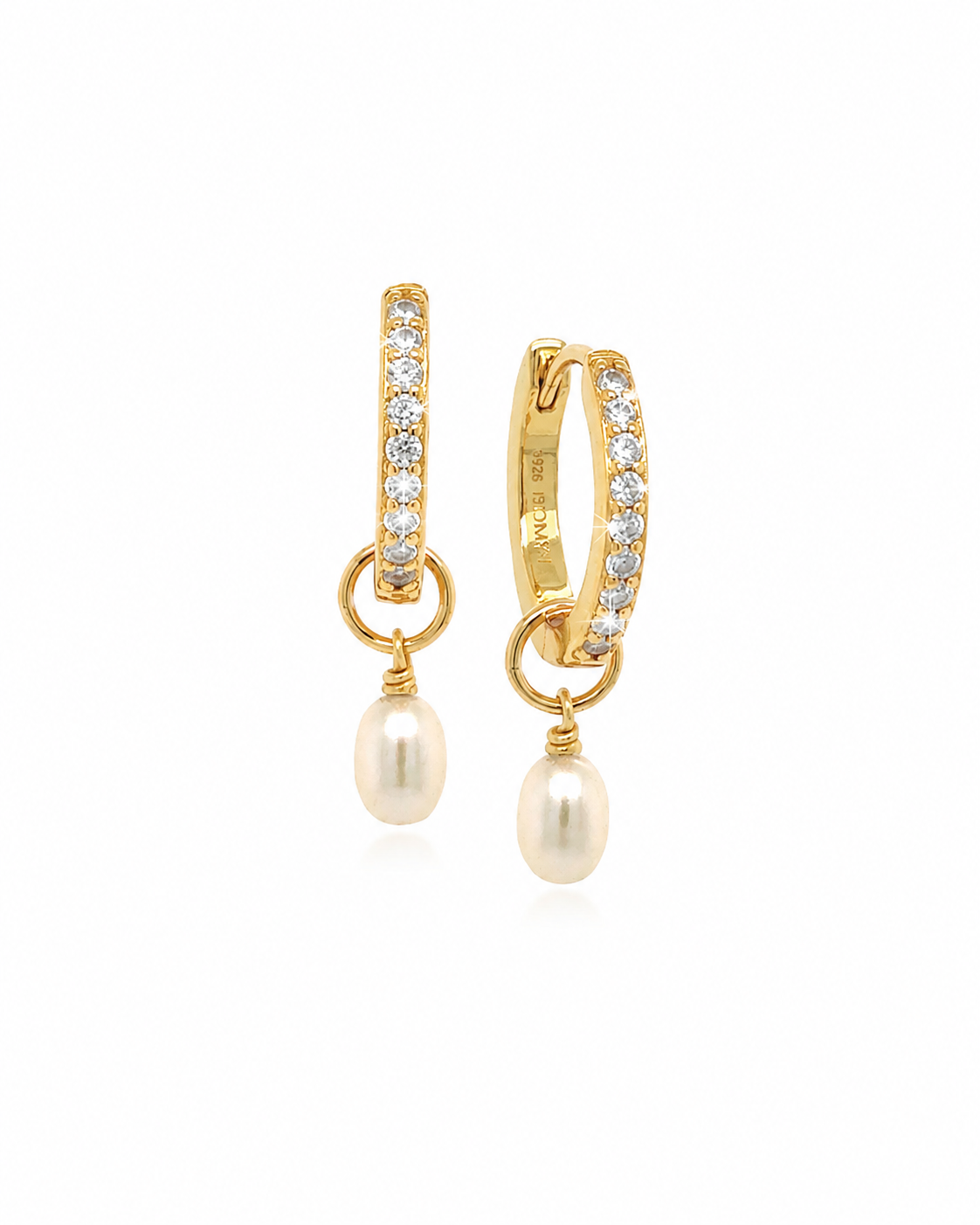 A pair of gold huggie hoop earrings adorned with pavé-set clear stones and dangling freshwater pearls, shown against a plain white background.