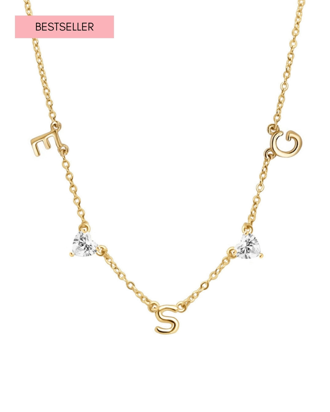 Gold-filled necklace with 3 letter charms and 2 heart gems evenly spaced on a petite rolo chain, styled on neutral-toned flatlay background