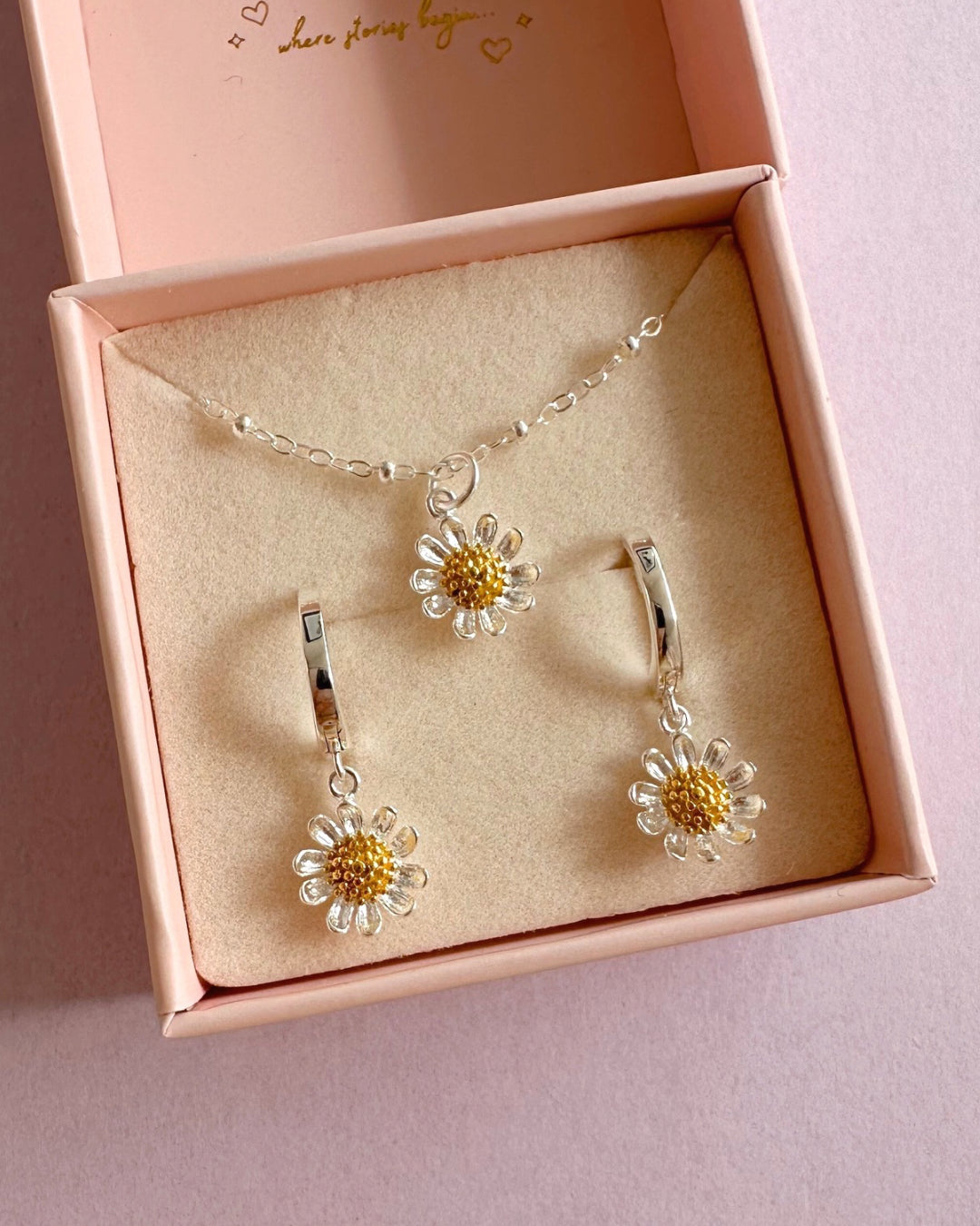Sterling silver Daisy Bloom Necklace and Earrings with a delicate silver satellite chain and two-tone daisy charm pendant, featuring sterling silver petals and a soft gold centre. Dainty Floral Necklace and Hoops are presented in a Romyli gift box