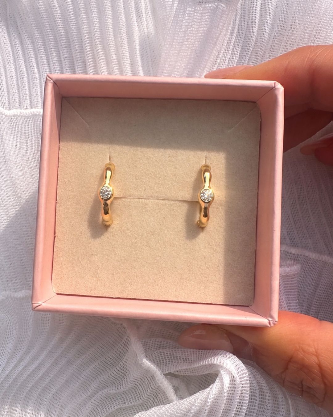 Romyli Sculpted Hoops in 18k gold vermeil presented in a pink jewellery gift box