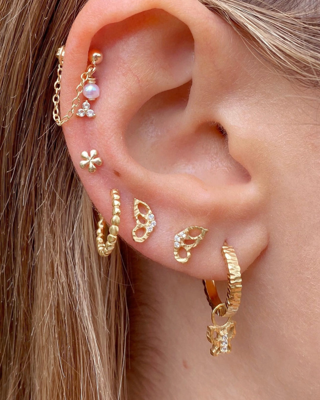 14k gold fill butterfly flutter earring studs on a model