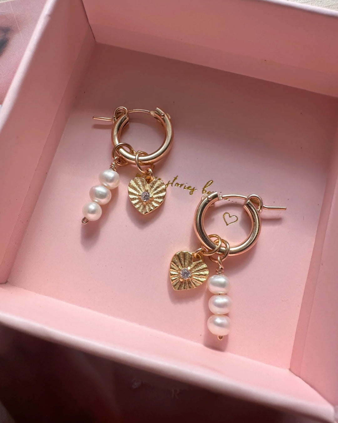 14k gold filled Mini Euro Hoops paired with Love Amulet and Pearl Trio Earring Charms in a Romyli gift box. 