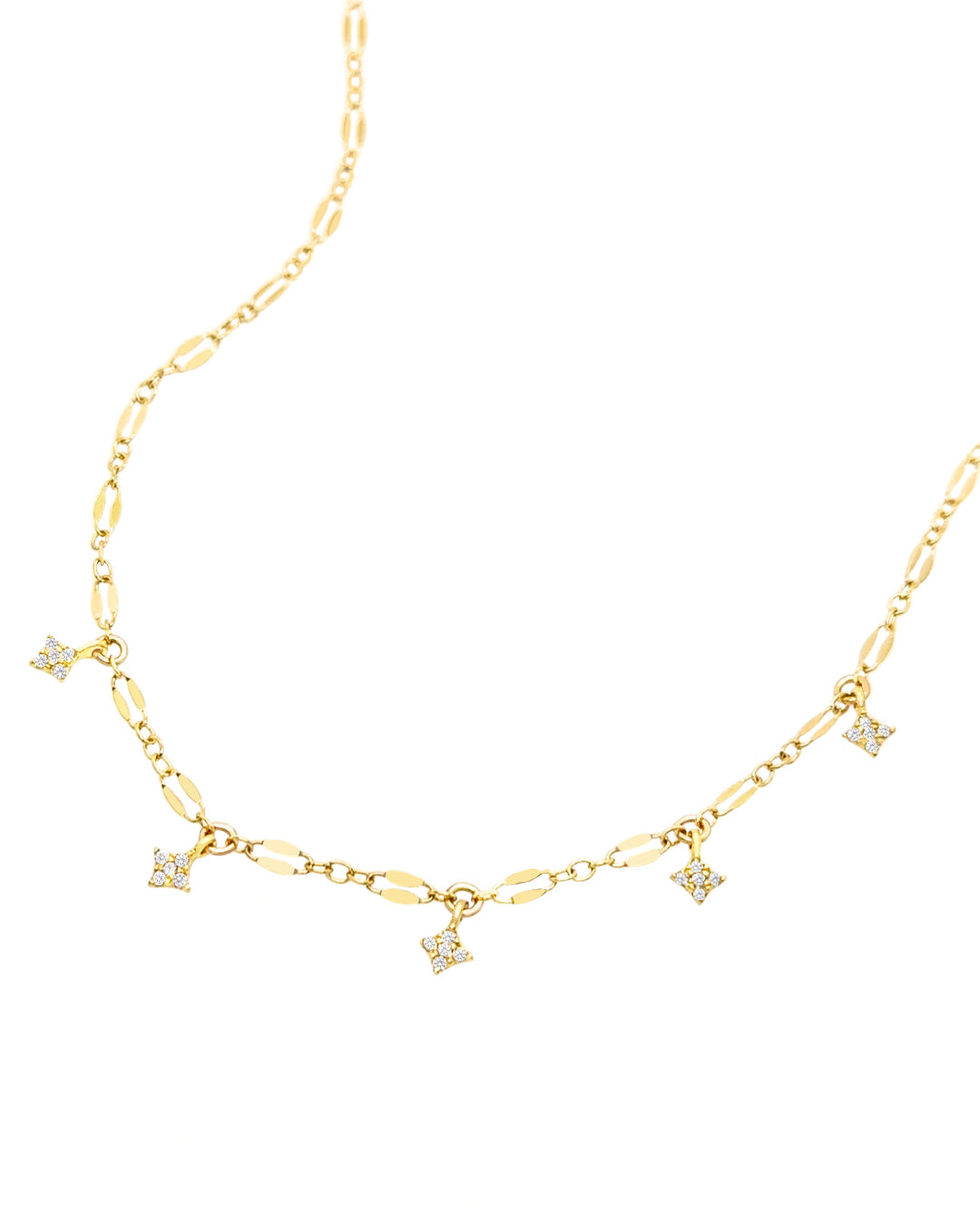 Choker length Aurora Star Necklace with light-reflecting chain and tiny crystal North Star charms.