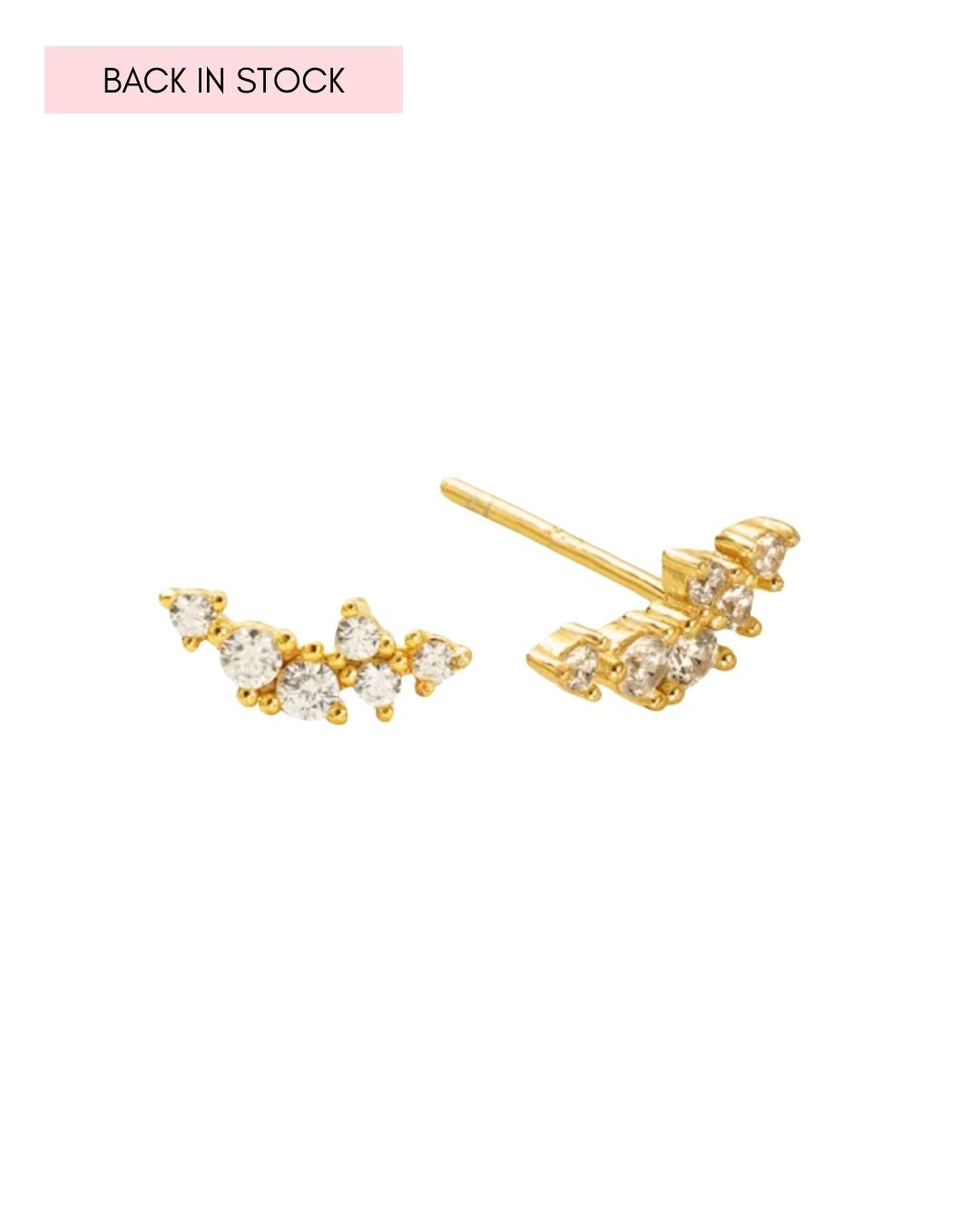 Gold climber stud earrings with a curved linear cluster of brilliant round crystals 