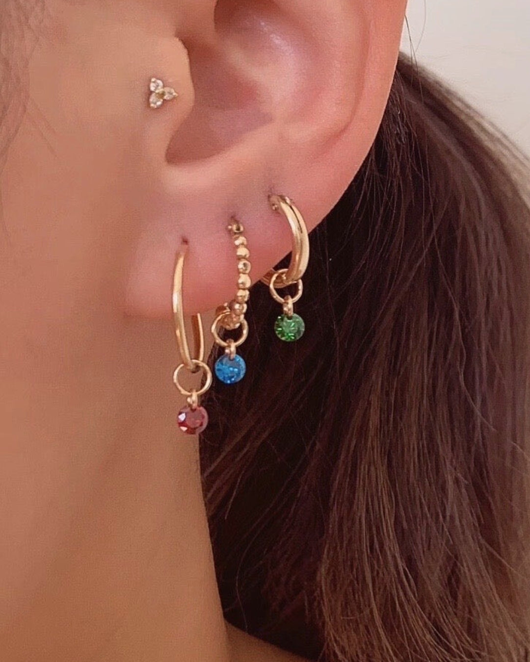 14k gold fill birthstone earring charms for hoops on a model 