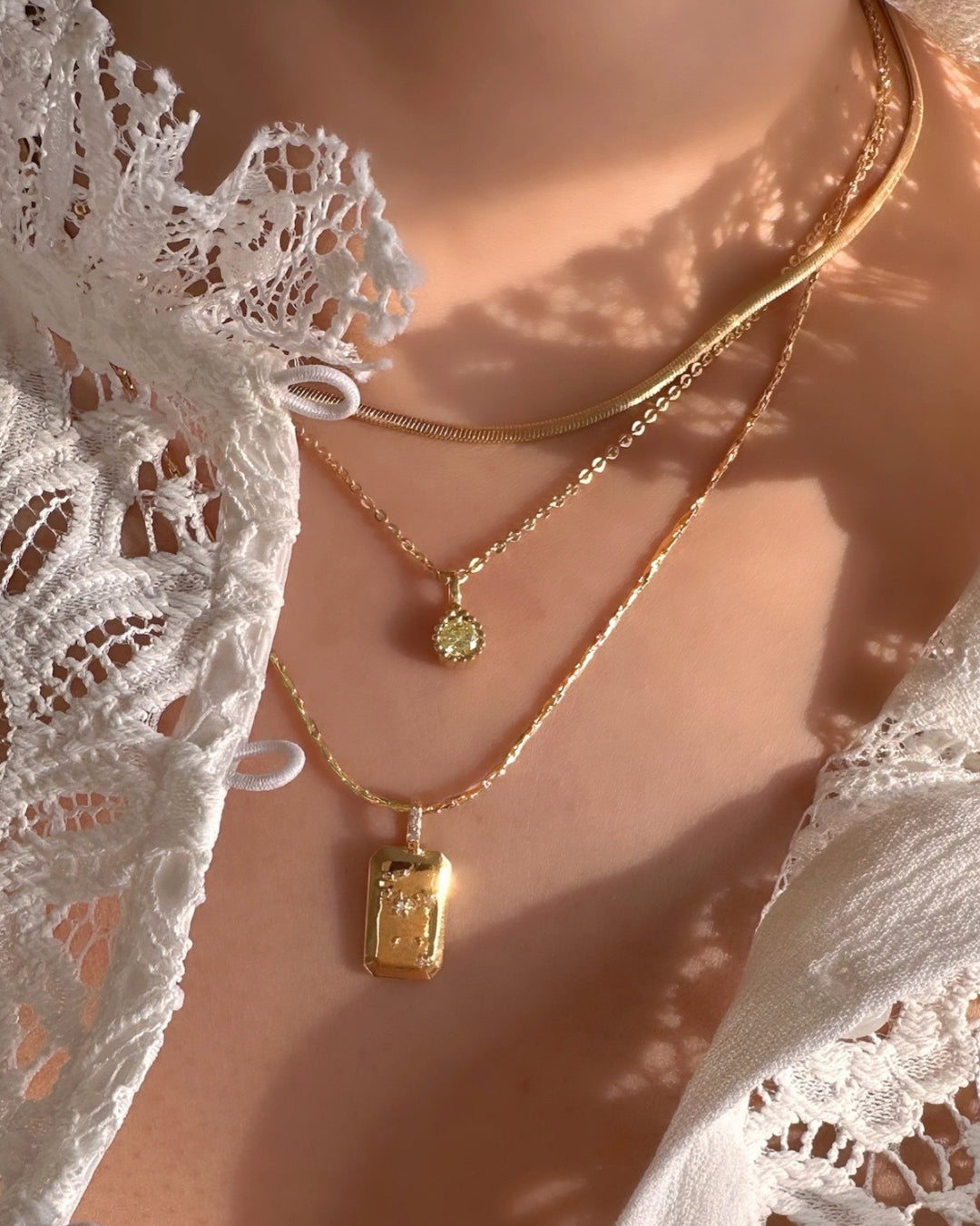 Leo Constellation Necklace layered with August Birthstone Necklace and Petite Snake Chain Necklace 