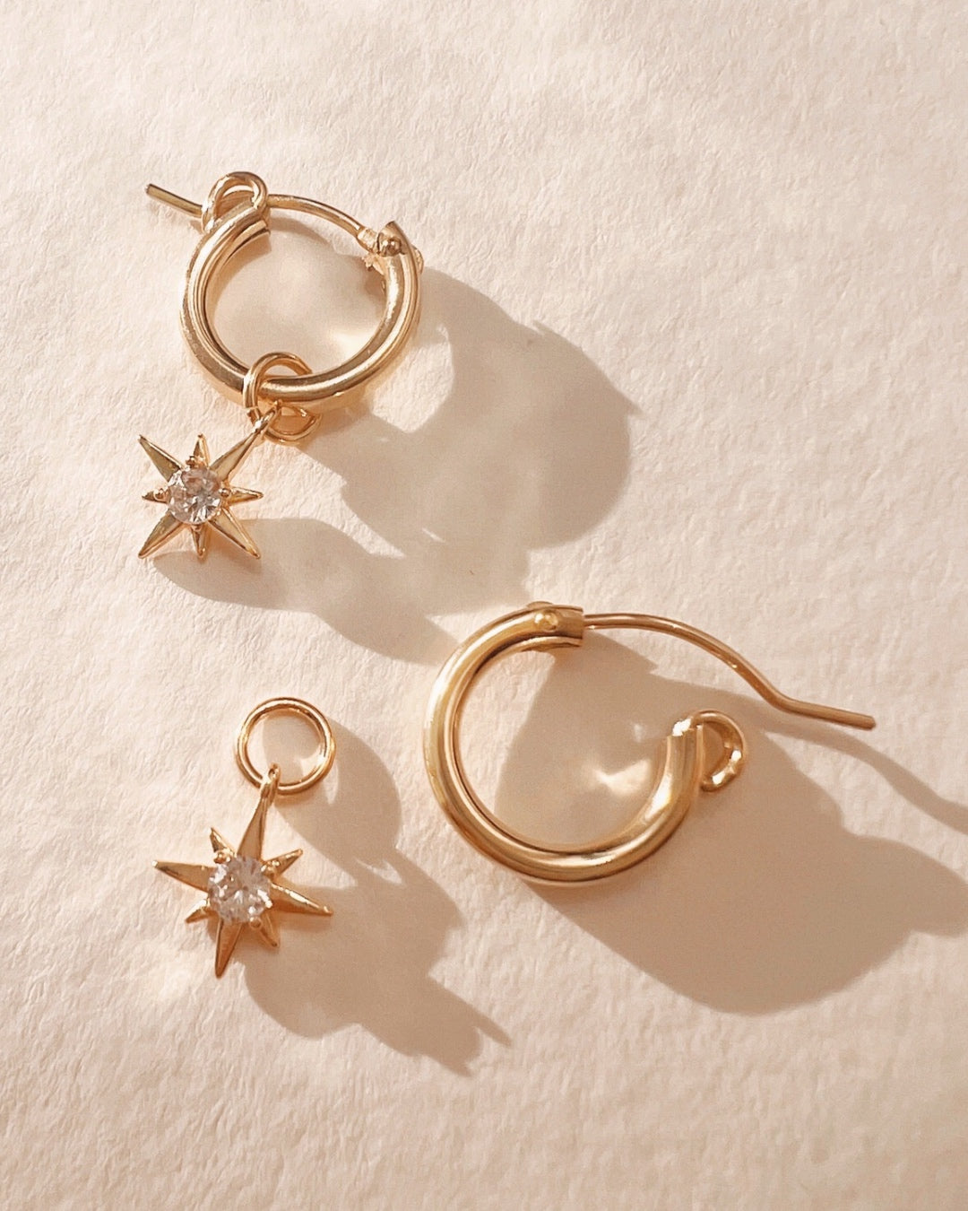 Gold North Star charm hoop earrings
