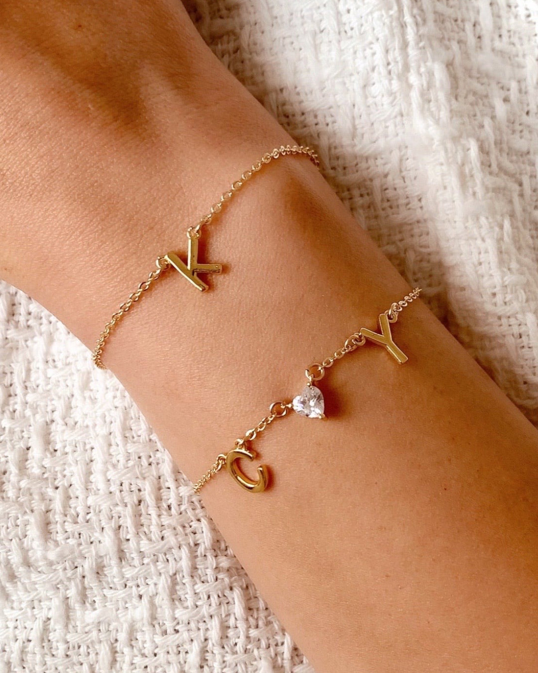 Customizable initial bracelet with the option to add up to 5 letters, gems or heart