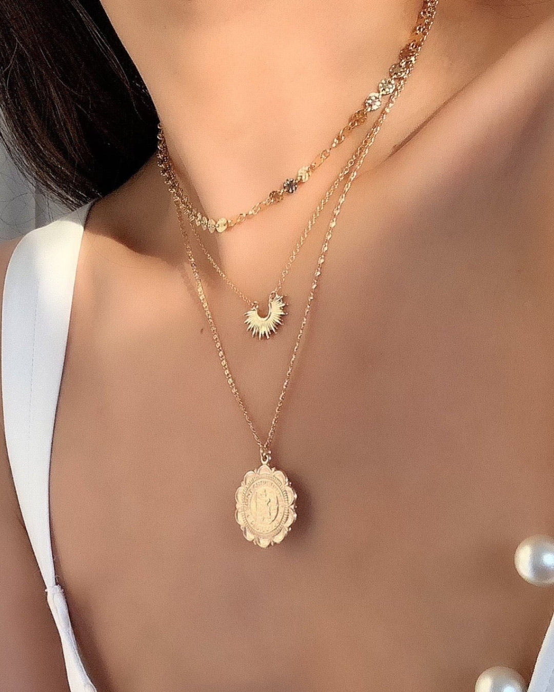 14k gold fill travelers medallion necklace featuring st Christopher protection travel pendant on a gold necklace chain on a model