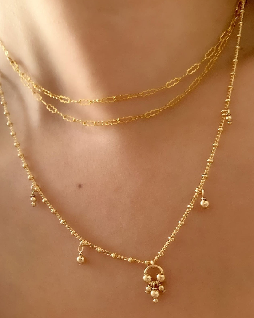 14k gold fill double strand choker necklace on a model 