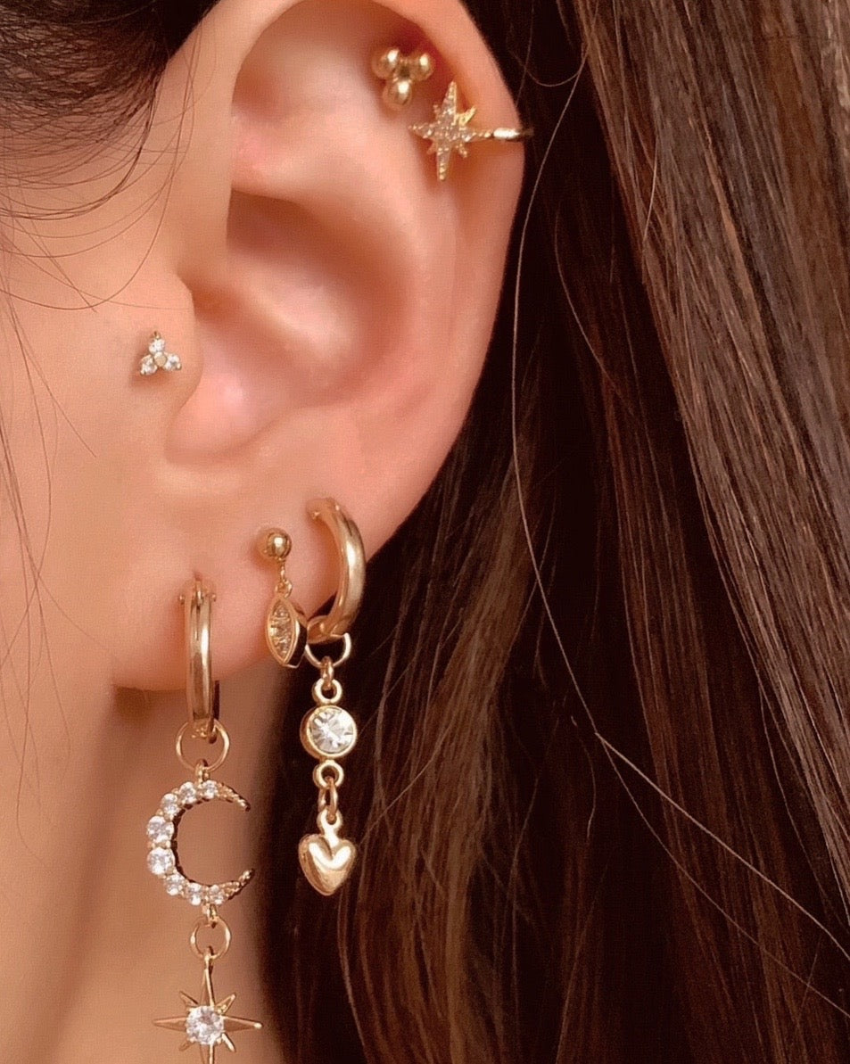 14k gold North Star Ear Cuff with pave cubic zirconia crystals on a model 