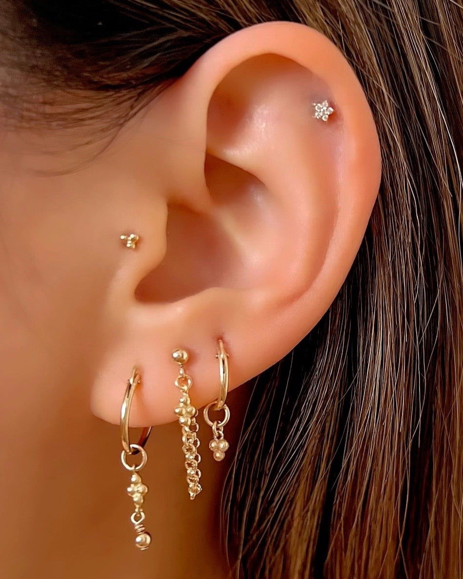 14k yellow gold fill mini spheres trinity Huggie hoops earring chain stud set. For lobe and helix piercing on a model 