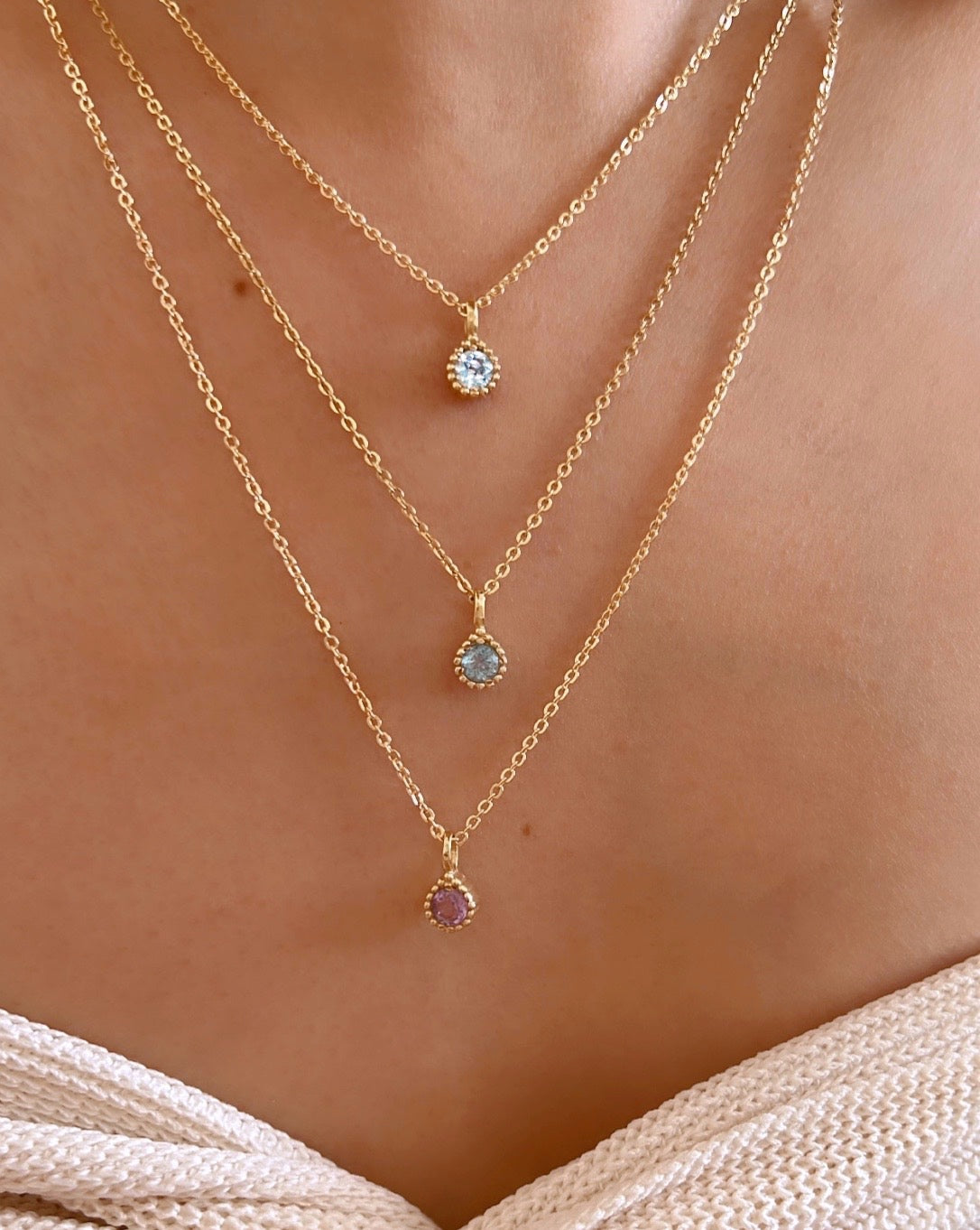 Gold December Blue Topaz Birthstone Necklace on a model 